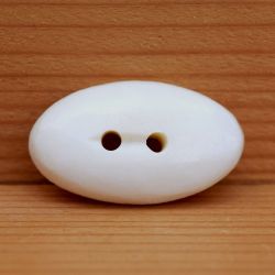 Smooth carved - cream oval - button